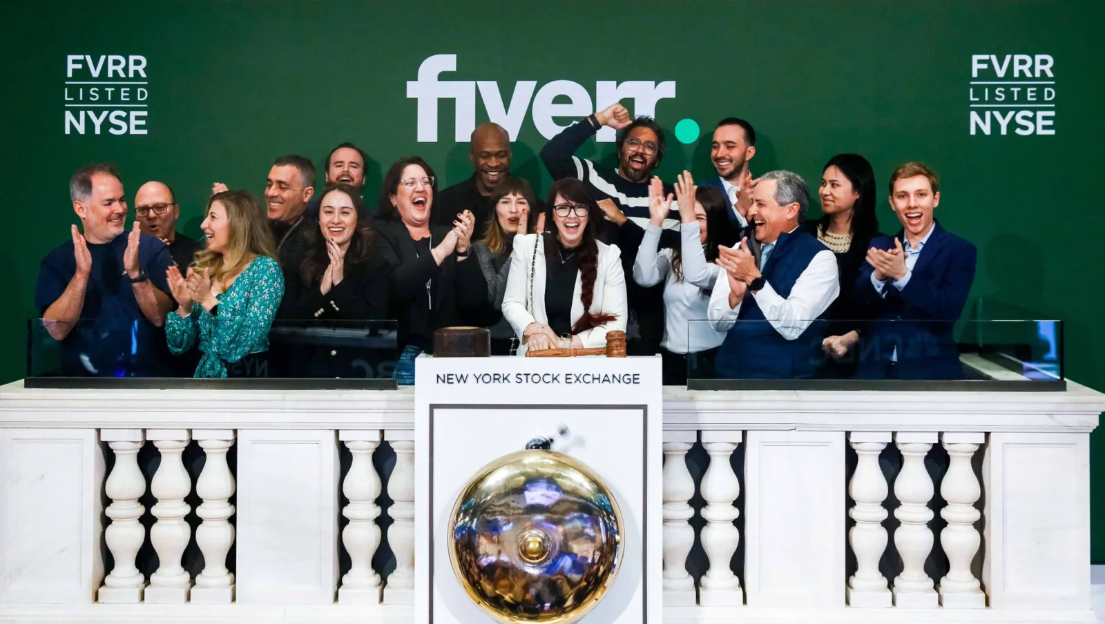 Mark Santos, far right, applauding with the Fiverr group at the New York Stock Exchange podium under a Fiverr banner